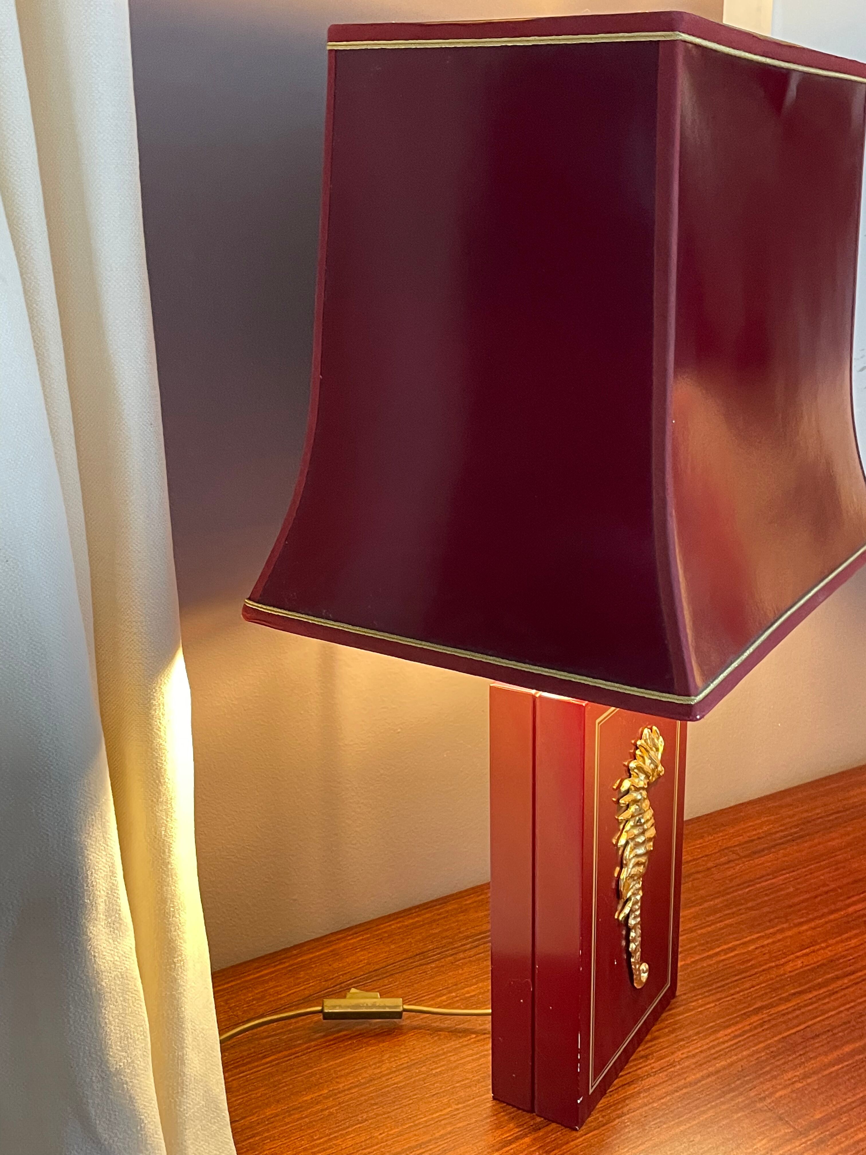 Pair of table lamps in Bordeaux lacquered wood and brass seahorse