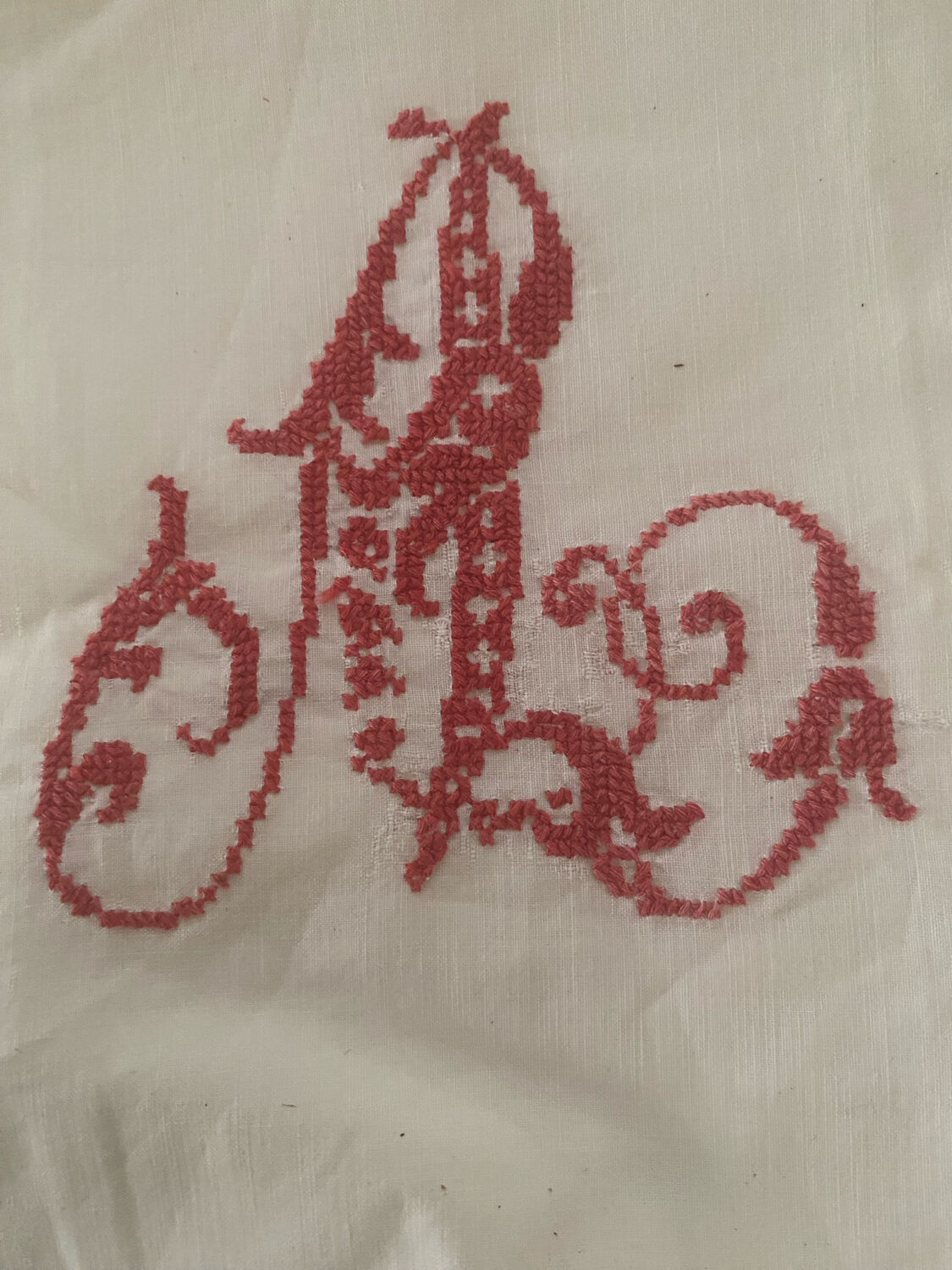 Antique white cotton pillowcase with crochet and monogram.