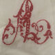 Antique white cotton pillowcase with crochet and monogram.