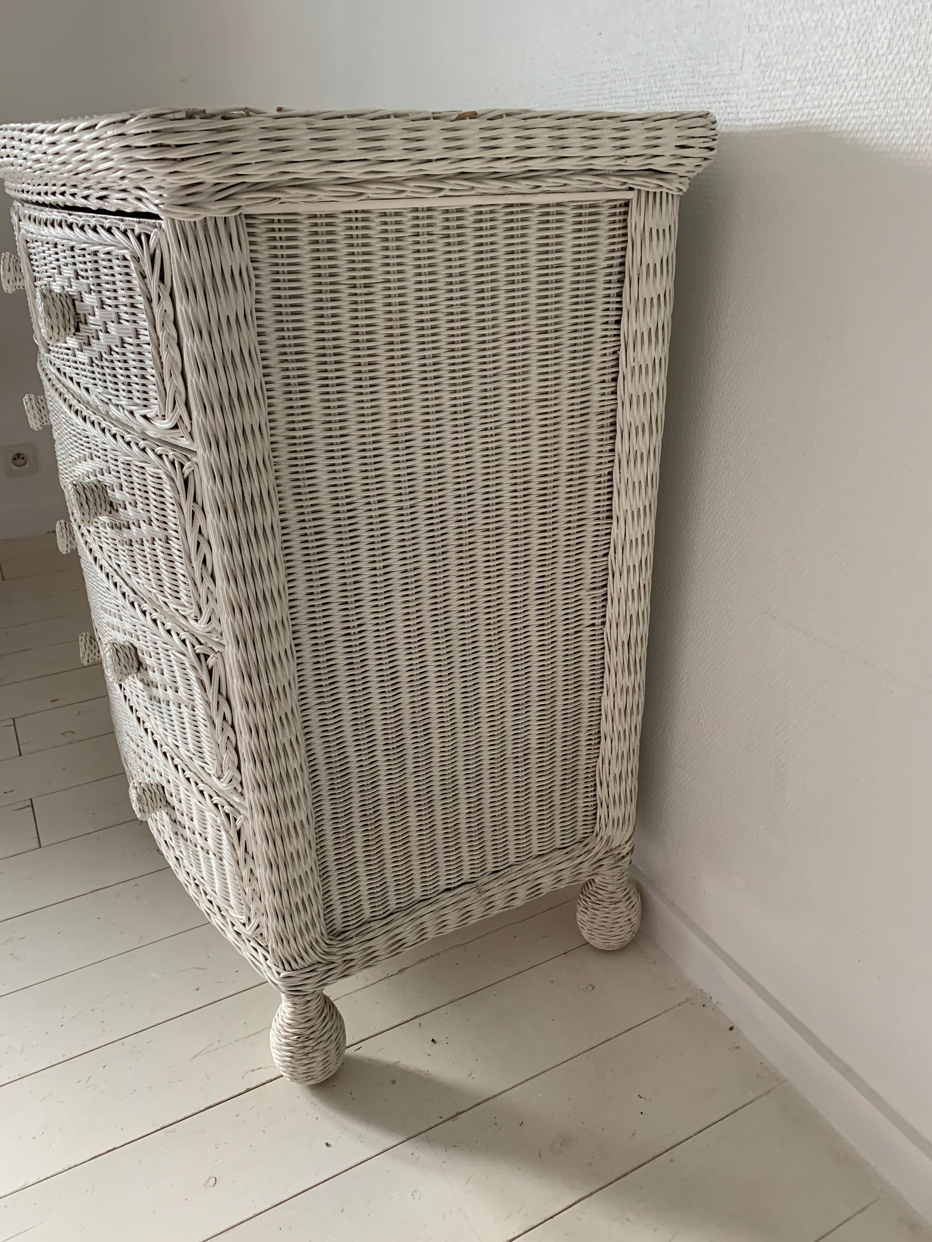 White dresser in vintage rattan