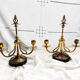 Pair of Empire style candlesticks, patinated brass and black stone.