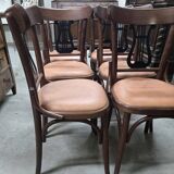 Set of 6 vintage curved wooden chairs, adorned with an elegant black lyre-shaped backrest.