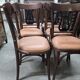 Set of 6 vintage curved wooden chairs, adorned with an elegant black lyre-shaped backrest.