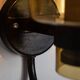 Pair of black metal wall lamps with yellow shades and inner diffuser