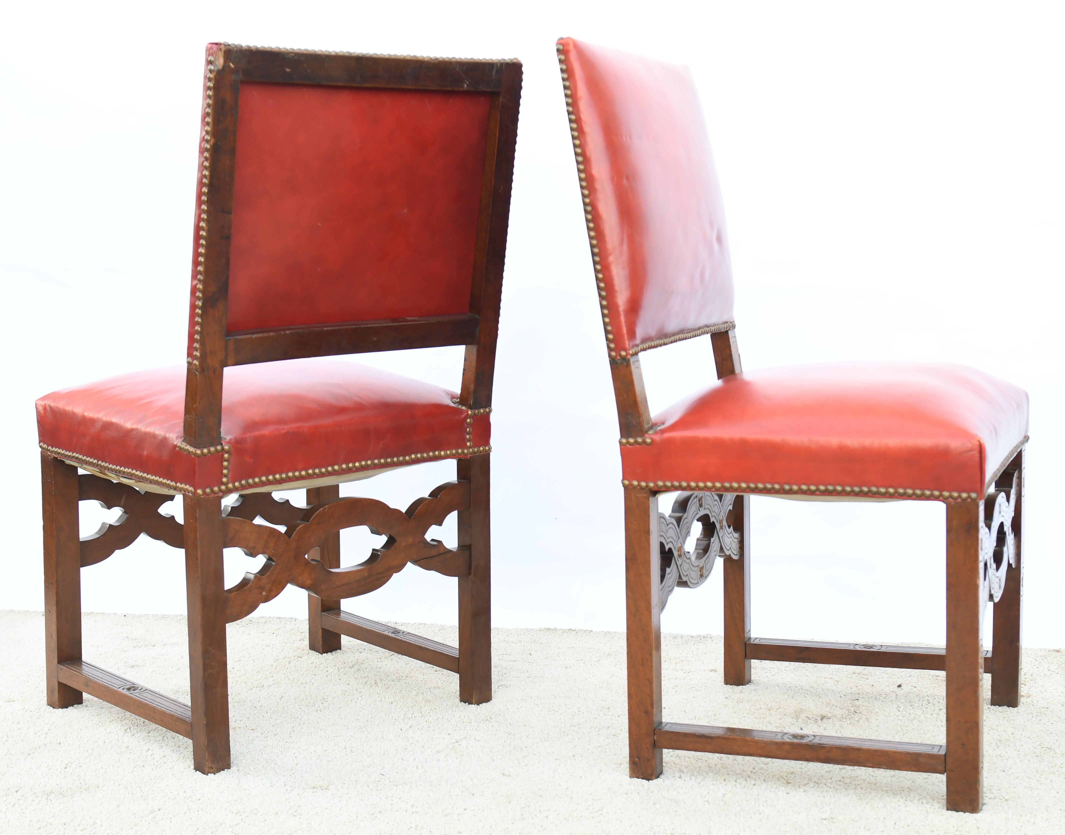 6 red leather chairs