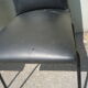 Lot de 2 chaises simili noir par Pierre Guariche