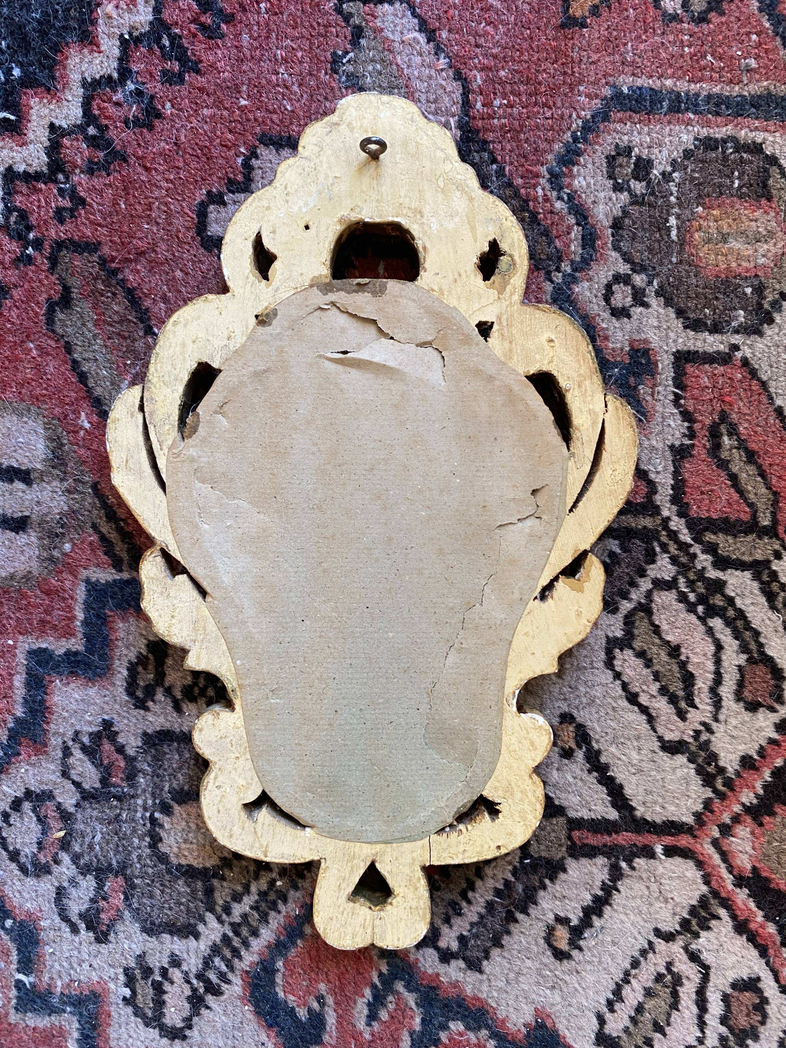 Golden mirror in baroque style.