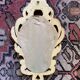 Golden mirror in baroque style.