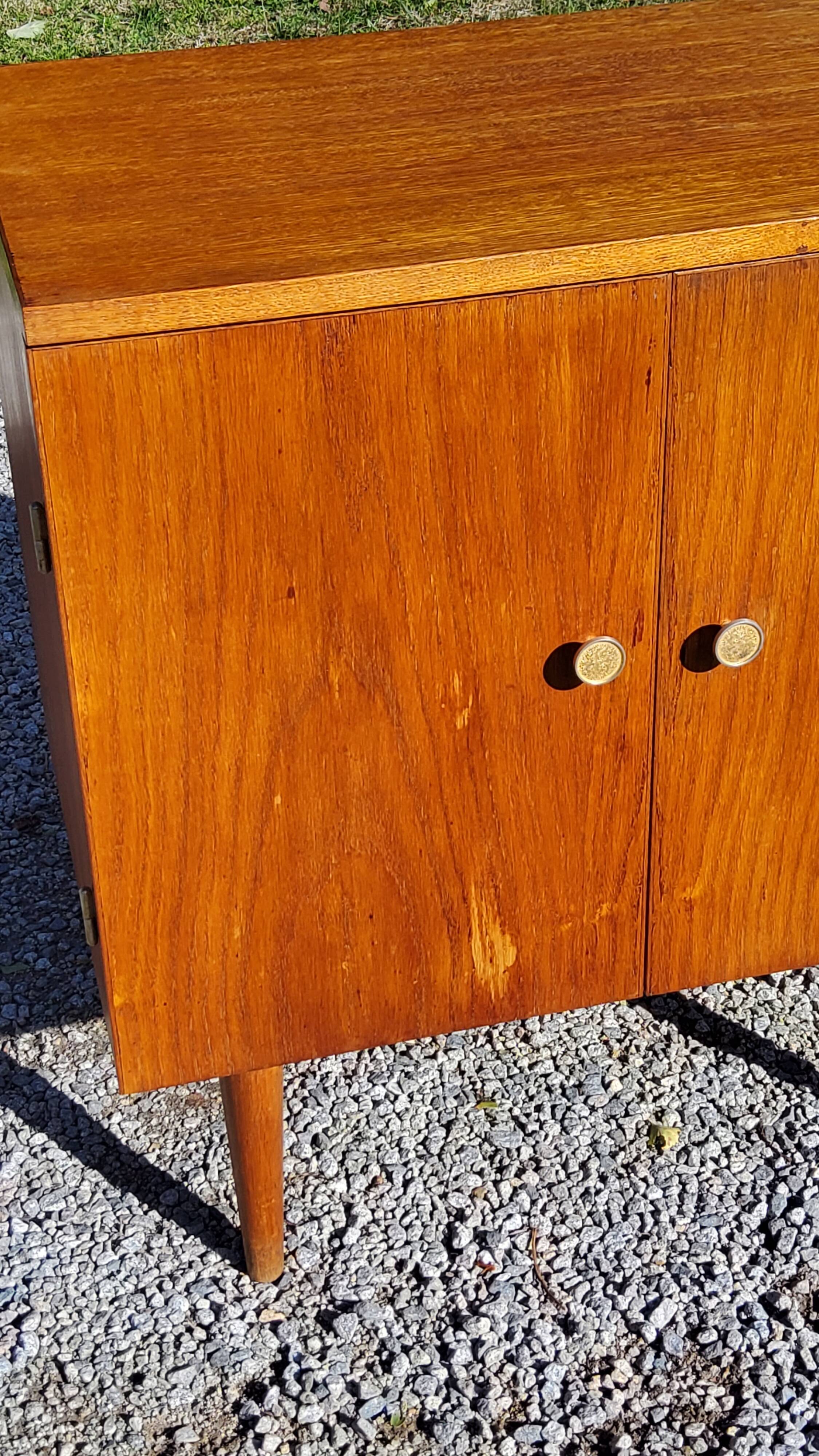 Vintage golden oak sideboard with conical legs from the 1950s