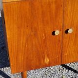 Vintage golden oak sideboard with conical legs from the 1950s