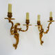 Former pair of double-light wall light in bronze or brass. Year 50 60