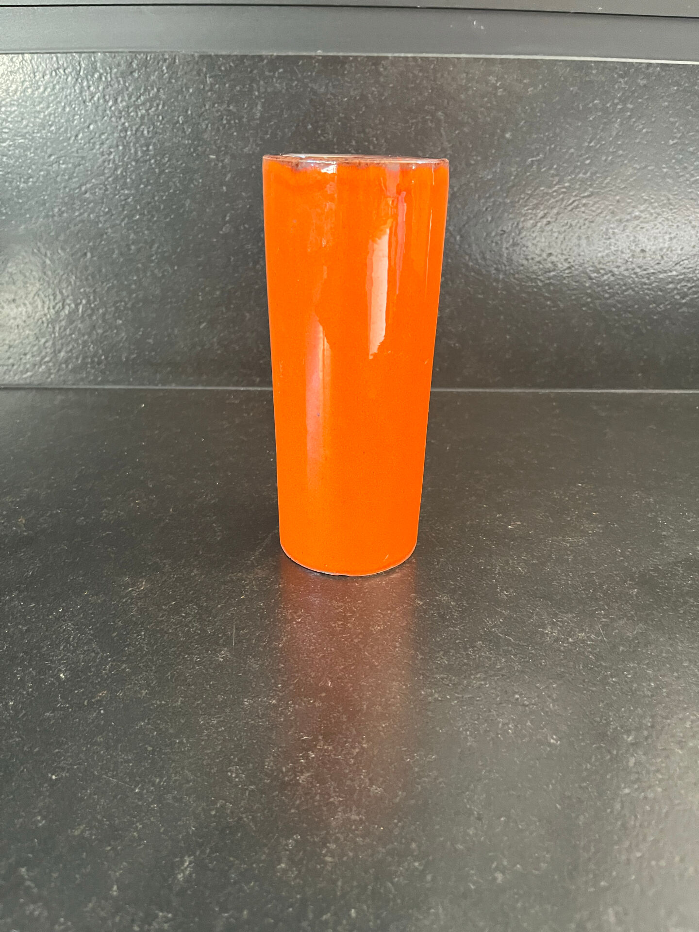 Orange glazed ceramic cylinder vase