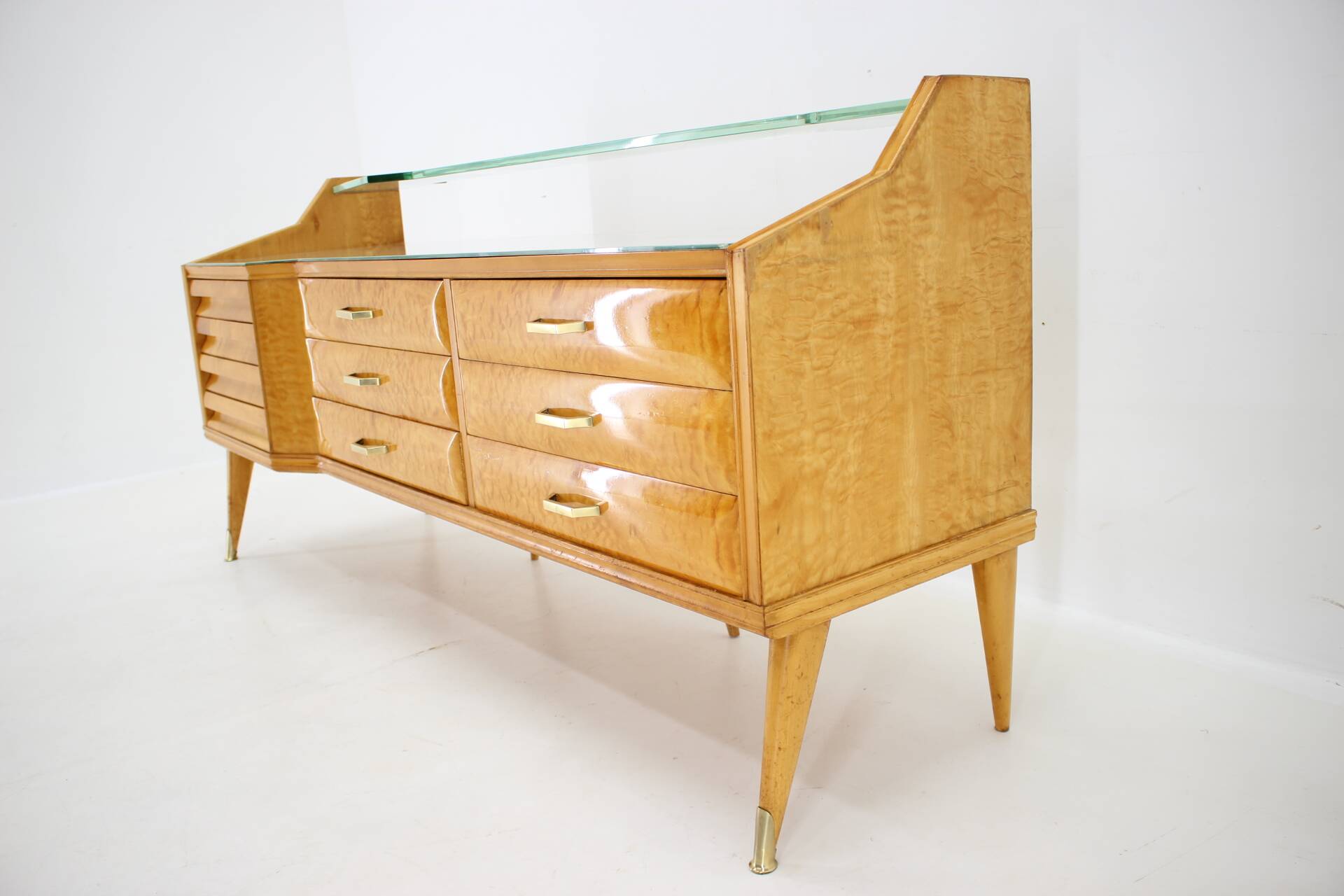 1960s italian sideboard/chest of drawers in high gloss finish with glass top and shelf