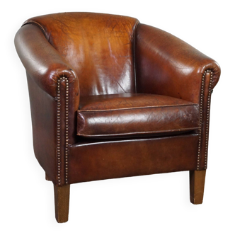 Comfortable and rugged vintage sheepskin club armchair with beautiful colors