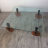 Glass coffee table on teak wheels