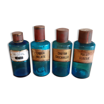 4 blue glass pharmacy bottles