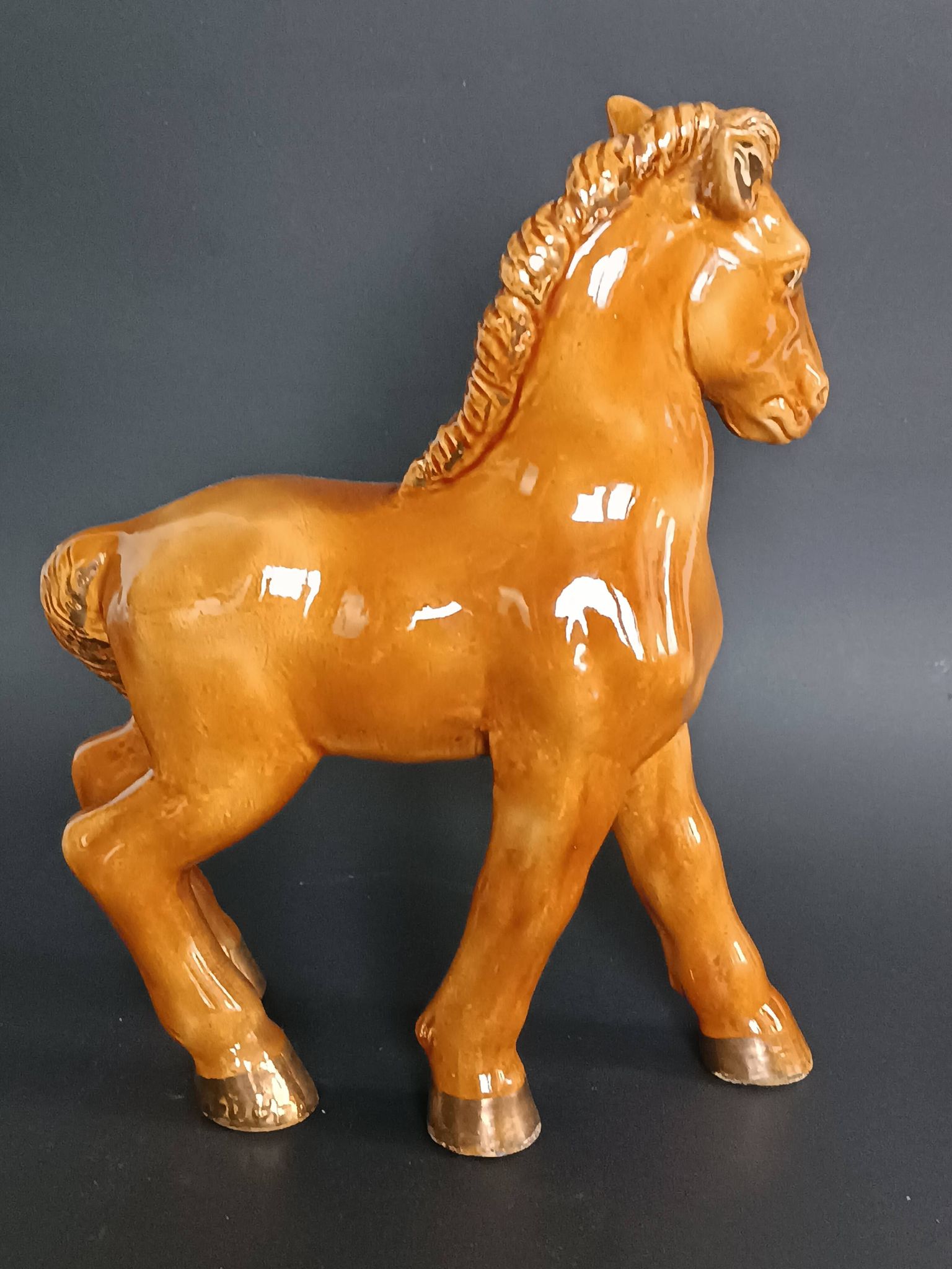 Ceramic horse sculpture with wild glaze and gold, signed Art Deco.