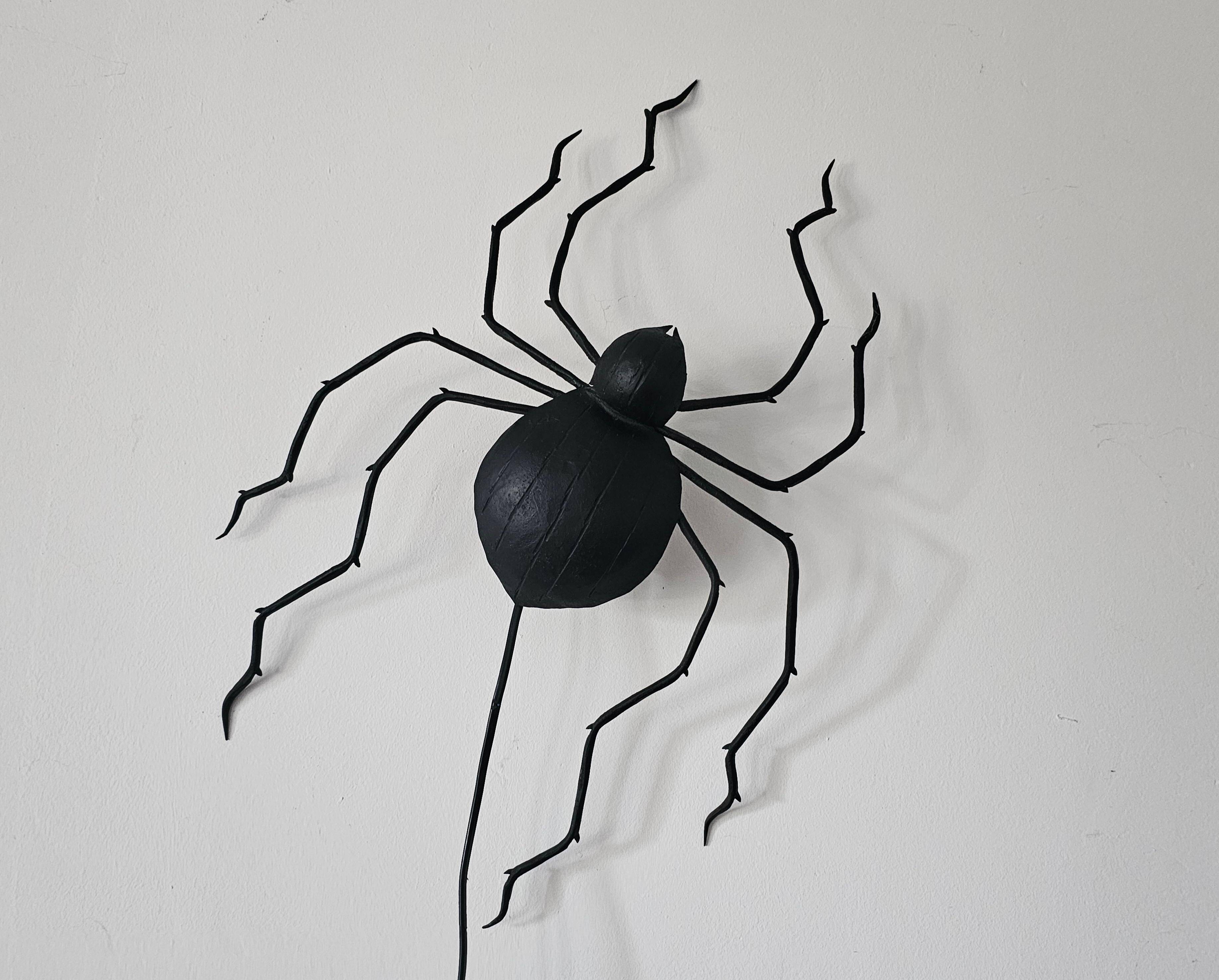 Wall lamp in iron Mid Century Modern spider style from the 1960s.