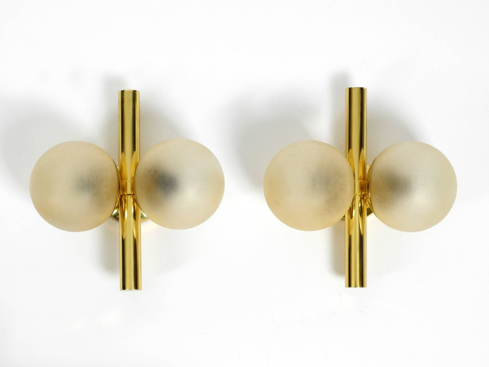 Pair of beautiful 60s Kaiser brass wall lamps with two golden glass spheres