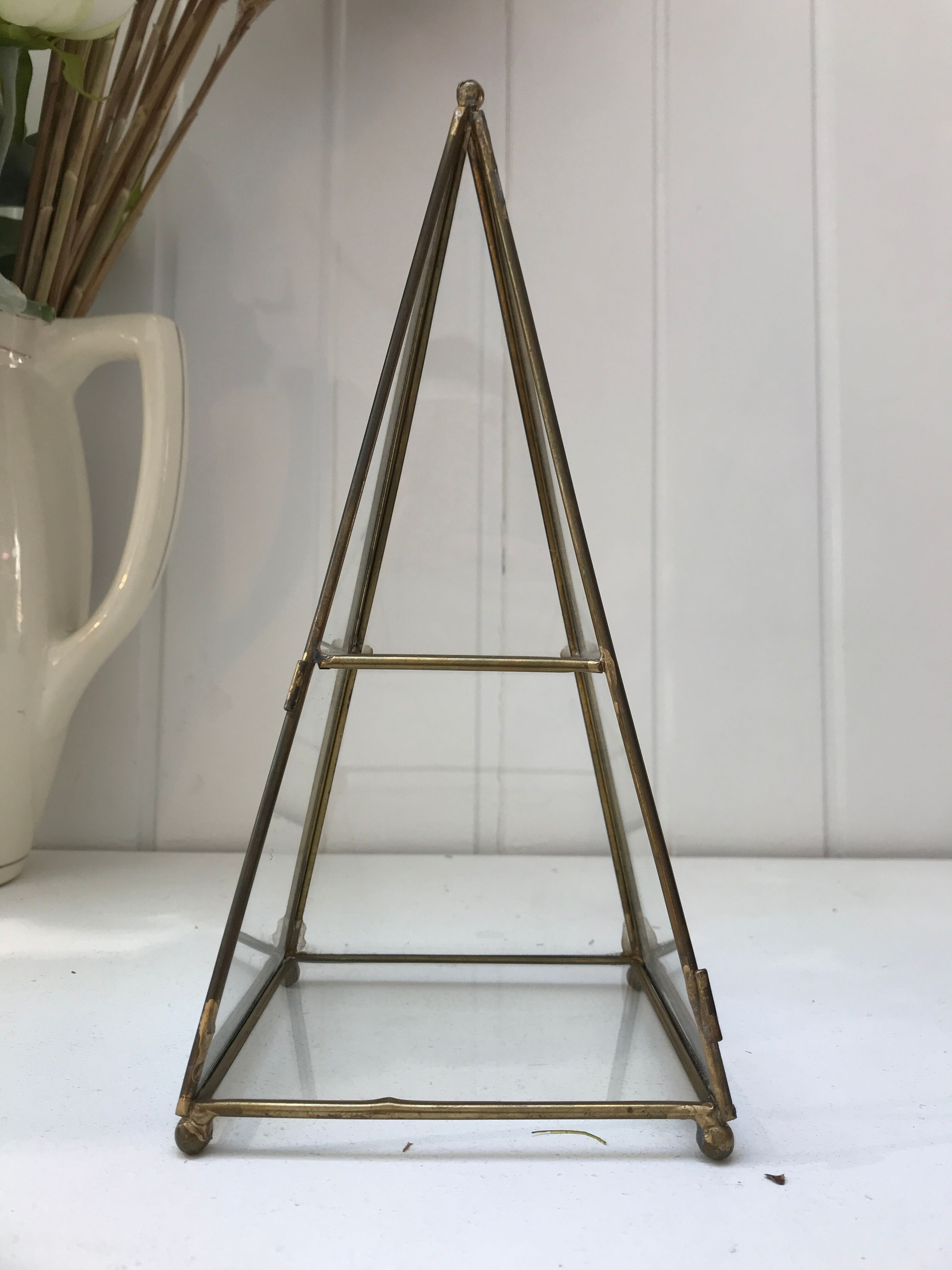Brass pyramid showcase