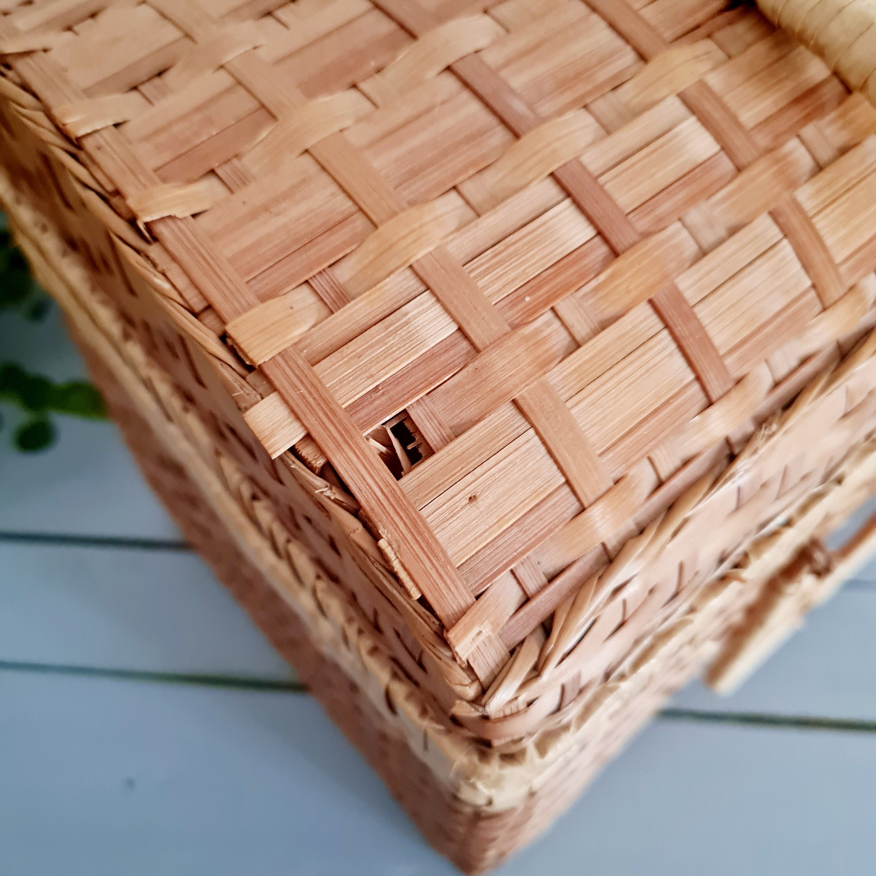 Small suitcase in vintage rattan trunk