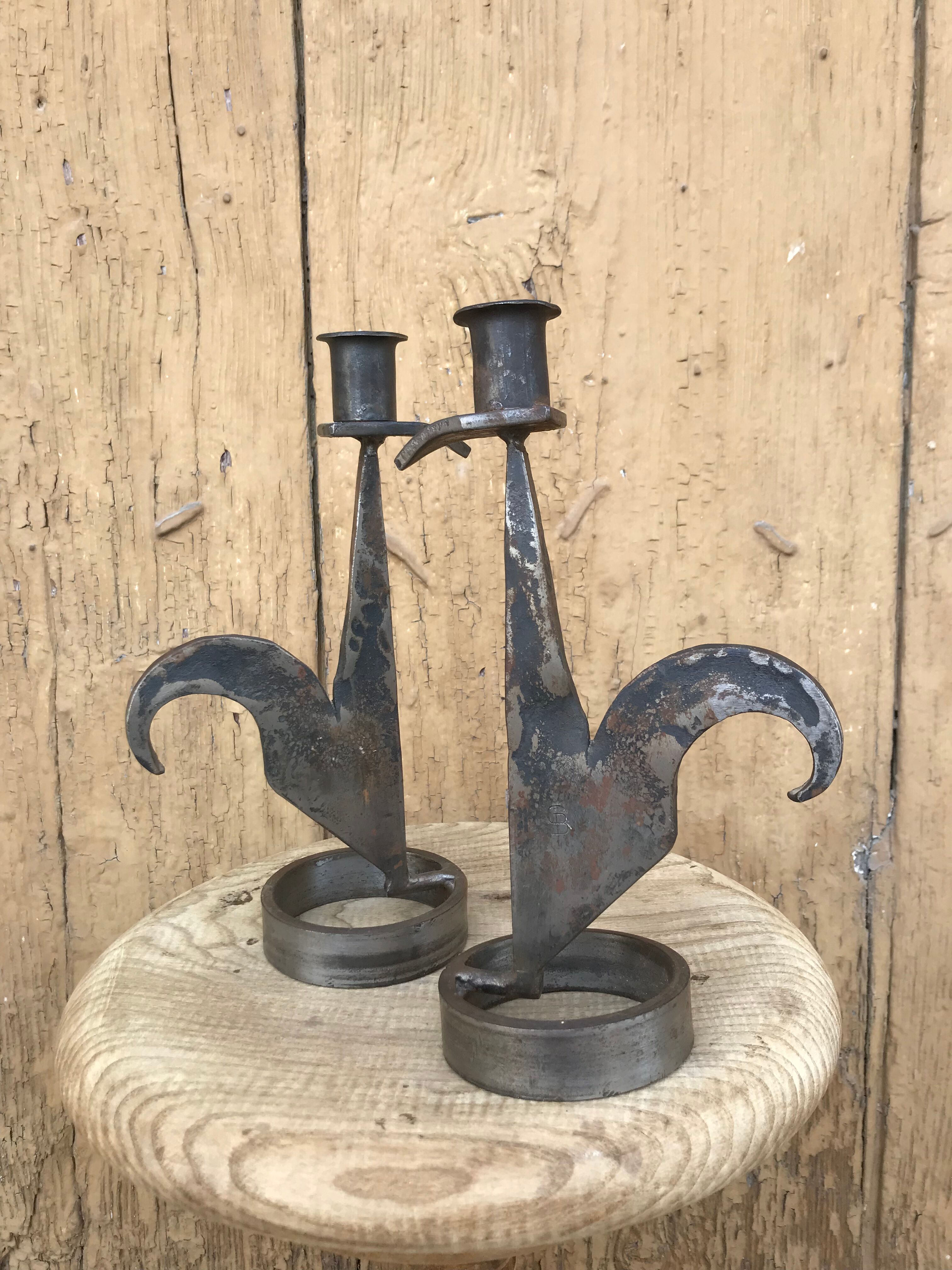 Signed zoomorphic iron candle holders