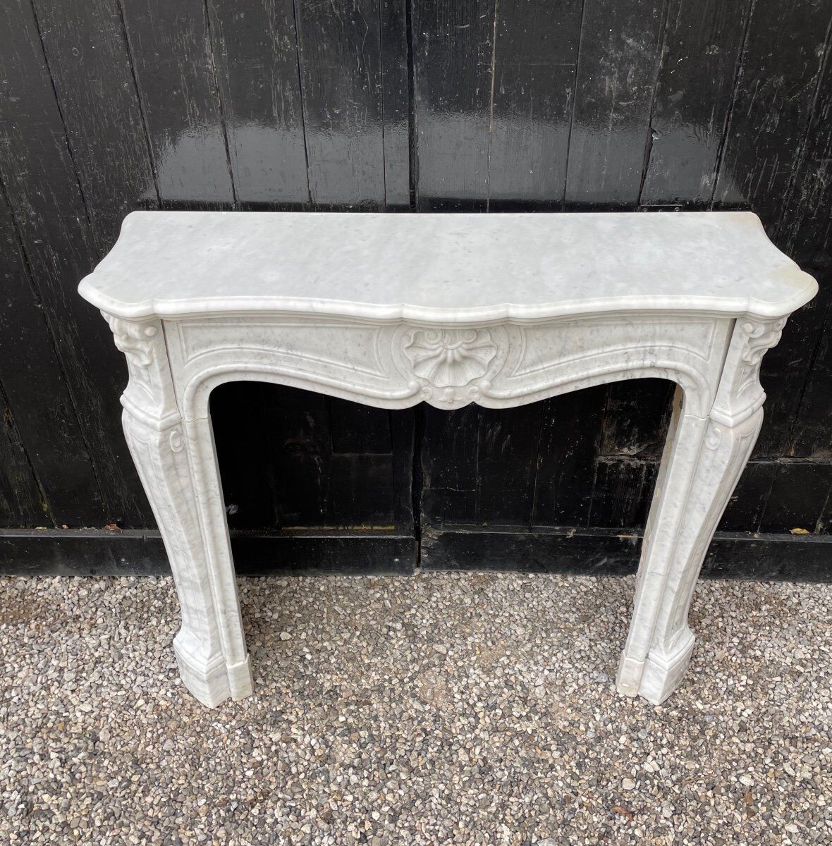 Louis XV style fireplace in Carrara marble