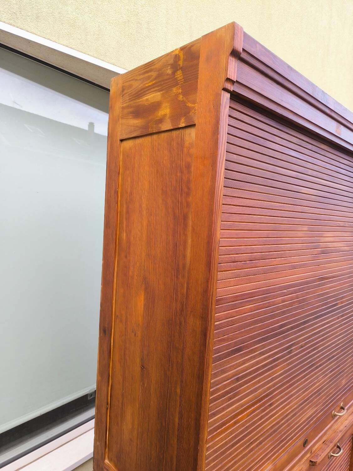 Vintage 1940s secretary desk with wooden curtains, storage, and shutters.