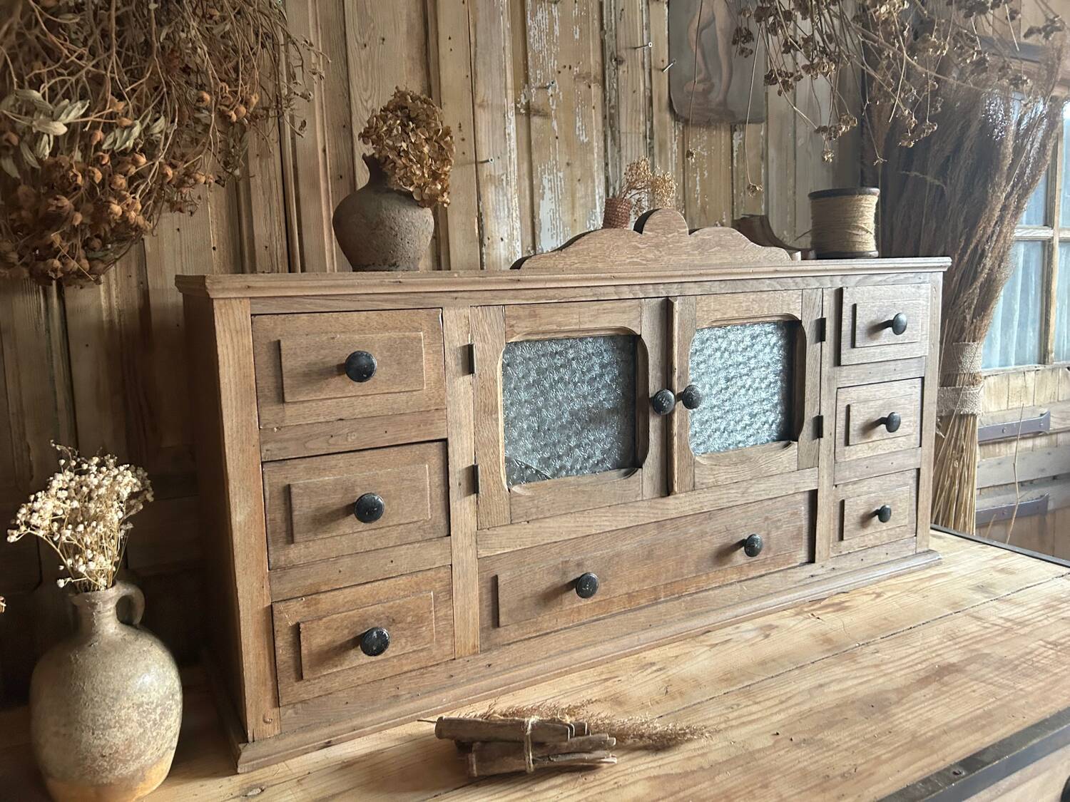 Small piece of furniture with glass doors and drawers