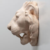Lion's head in painted plaster