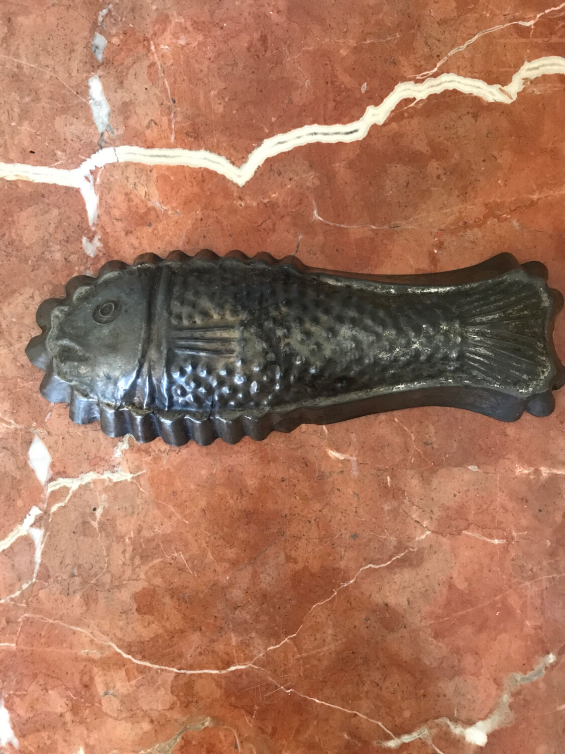 Old cake mold or chocolate fish