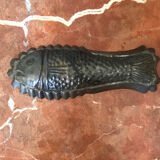 Old cake mold or chocolate fish