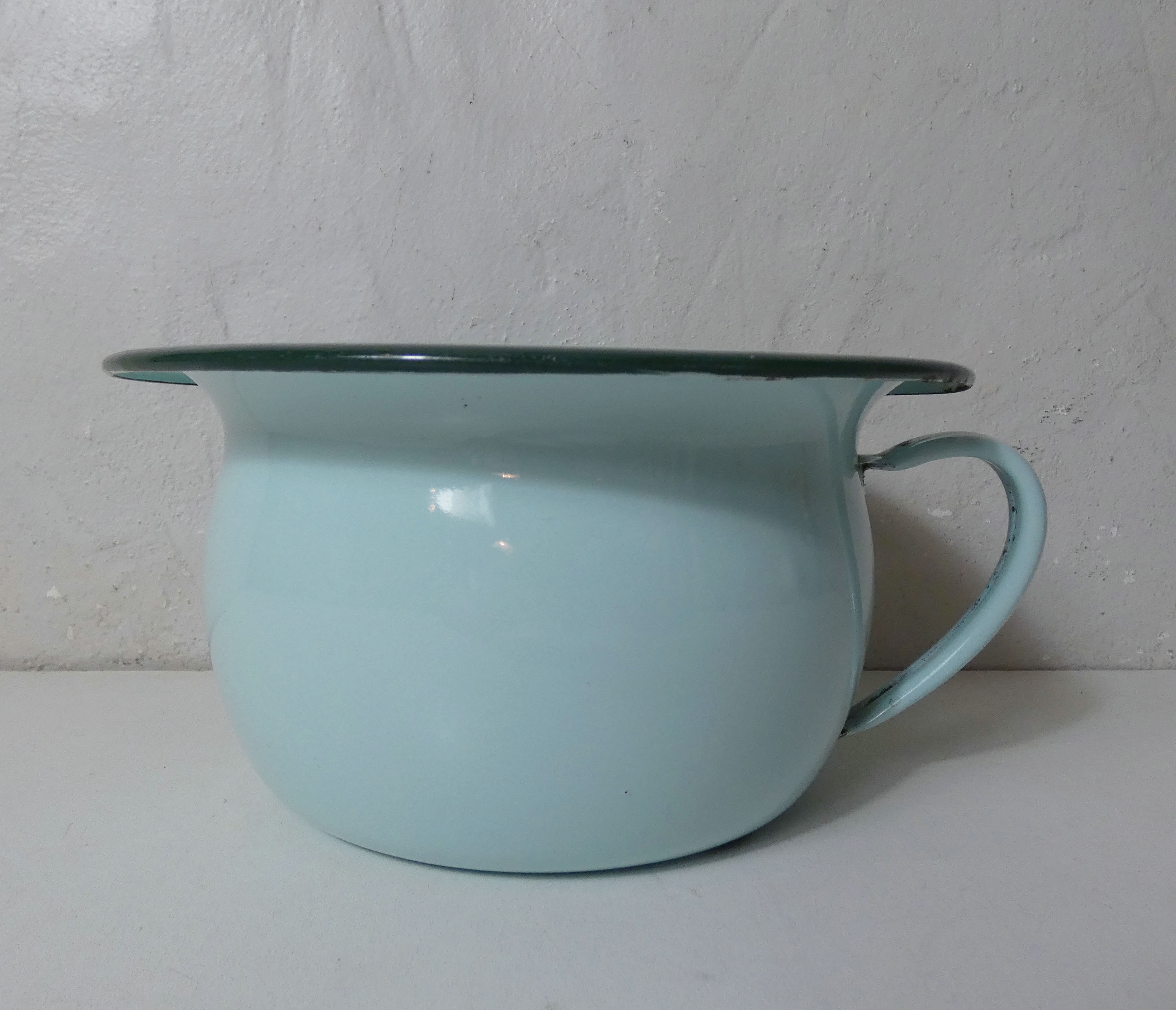 Old green enamelled steel pot cover