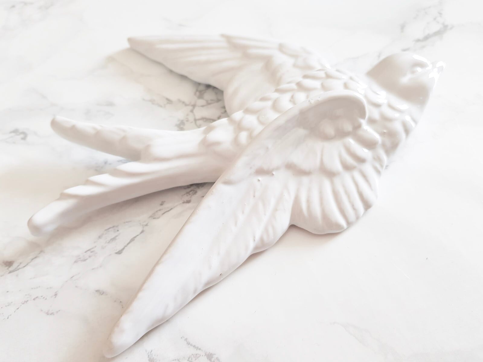 Set of three swallows in white earthenware