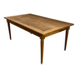 Dining table with tapered legs and solid exotic wood