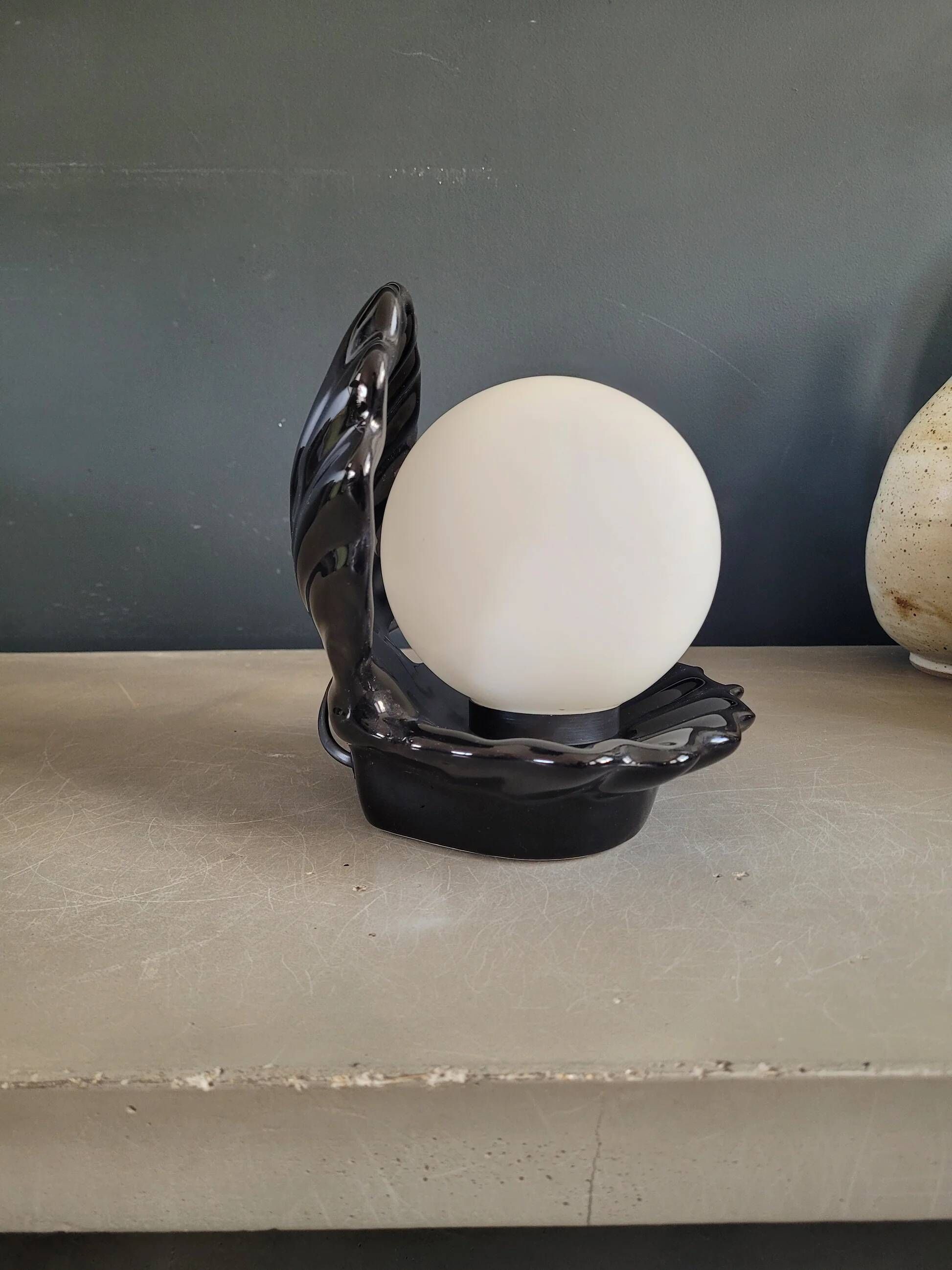 Vintage shell lamp in black porcelain with opaline globe.