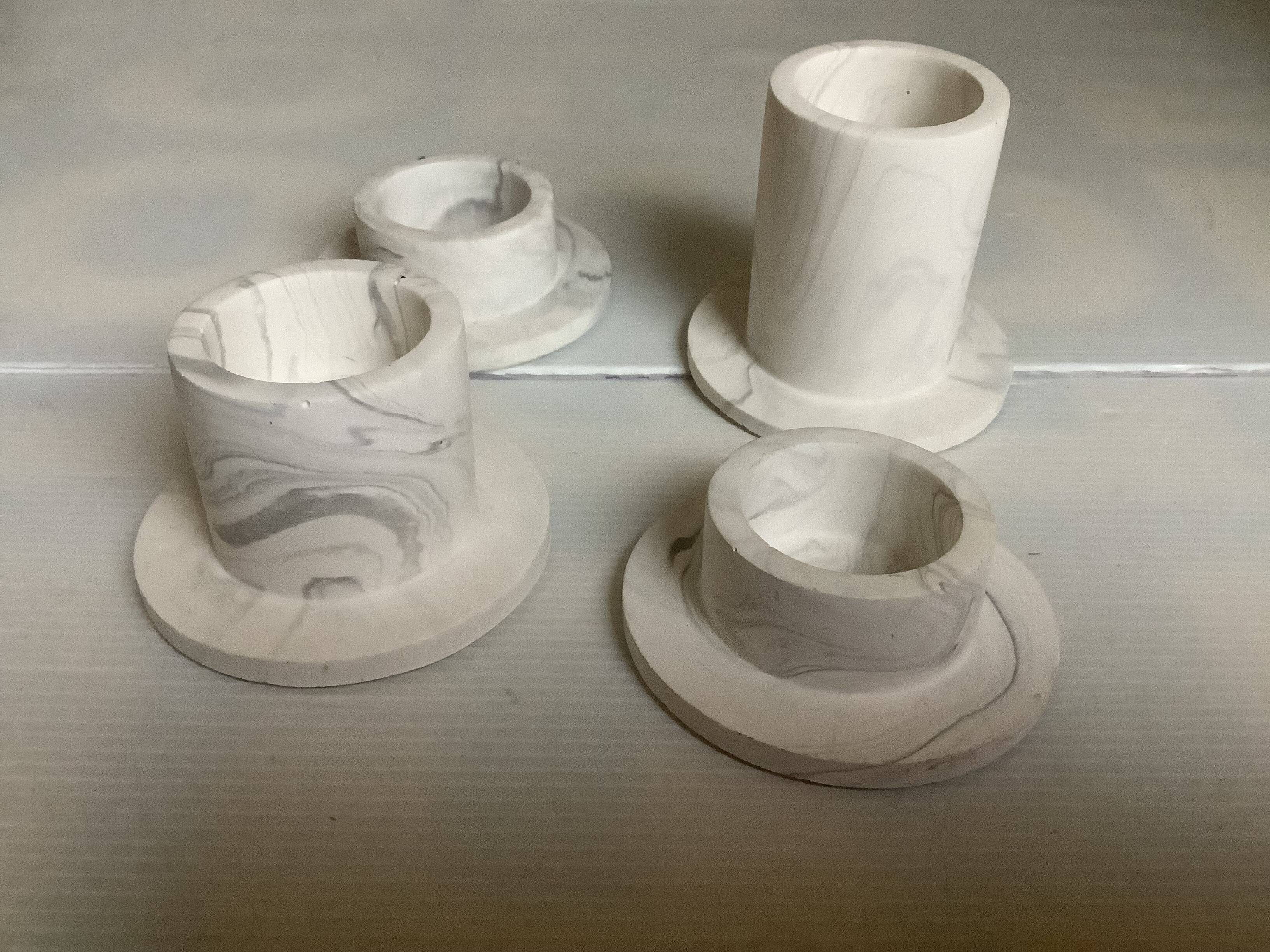 Four gypsum composite candle holders