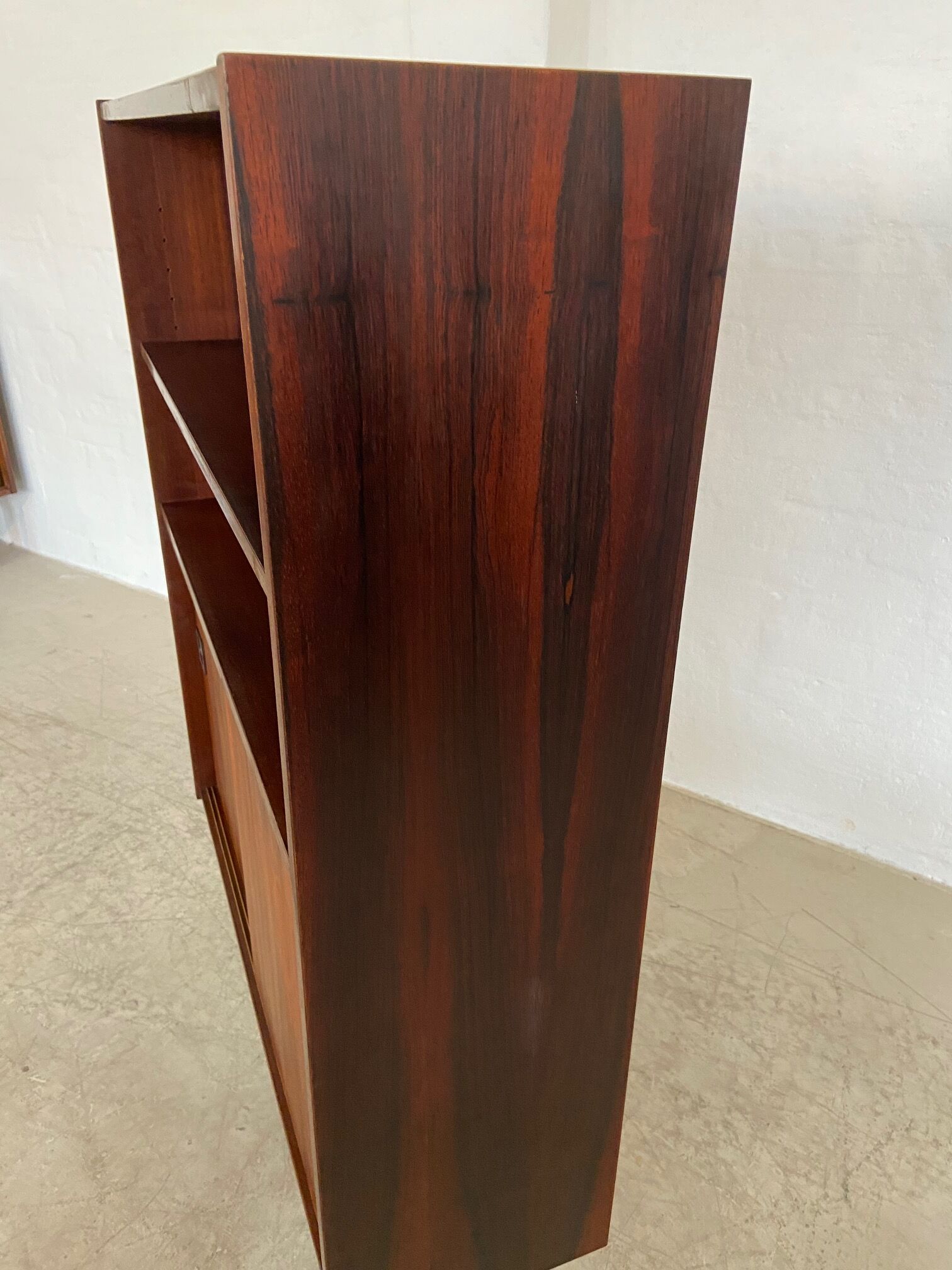 Danish retro vintage library in rosewood with sliding doors from the 1960s.