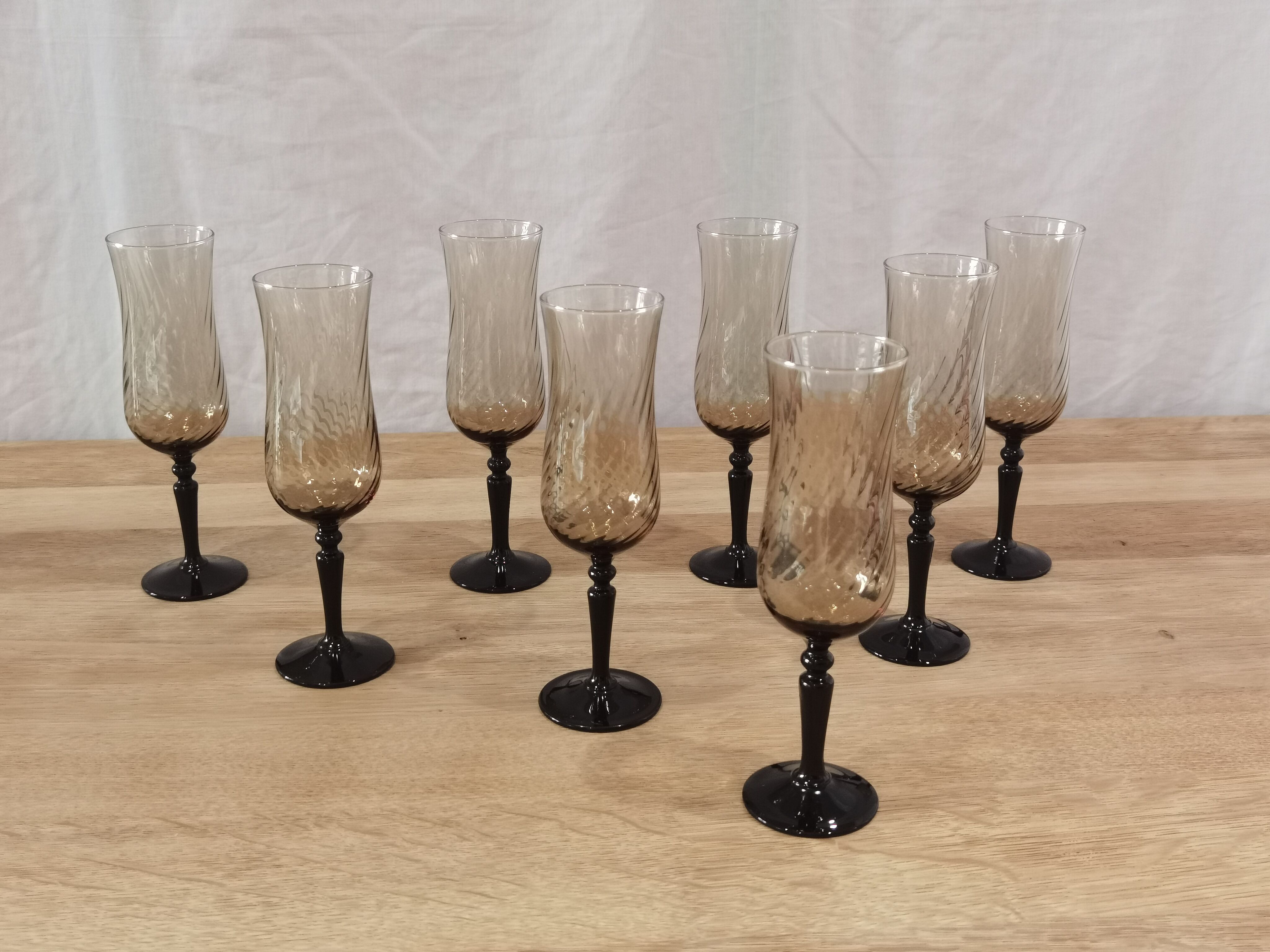 8 vintage smoked champagne flutes with black feet Arcoroc