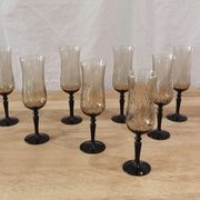 8 vintage smoked champagne flutes with black feet Arcoroc