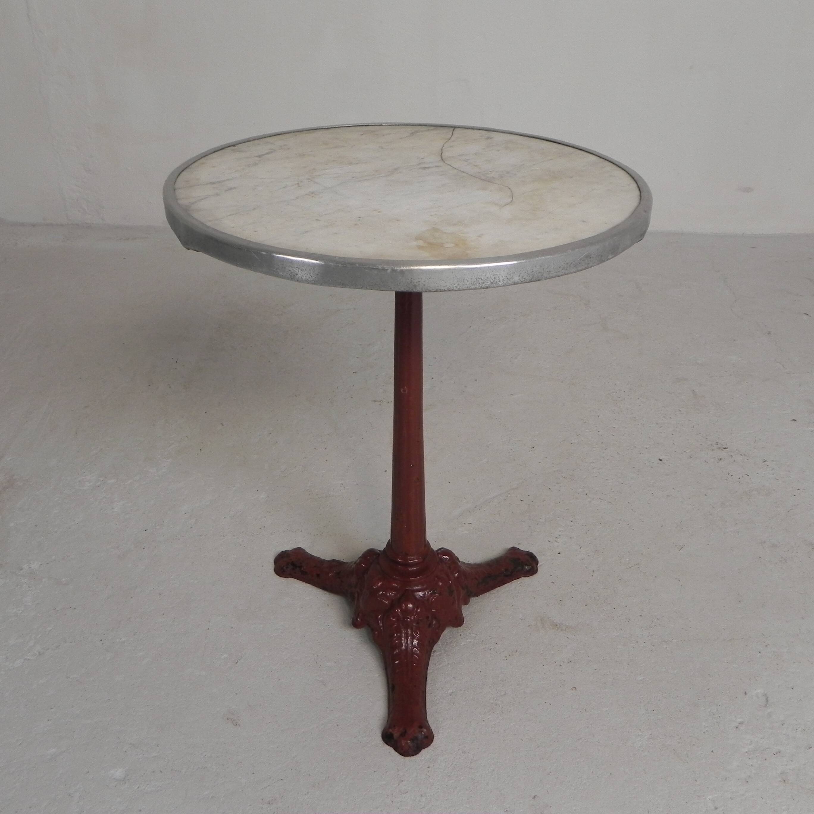 Bistro table with cast iron legs and marble top, 1920s.