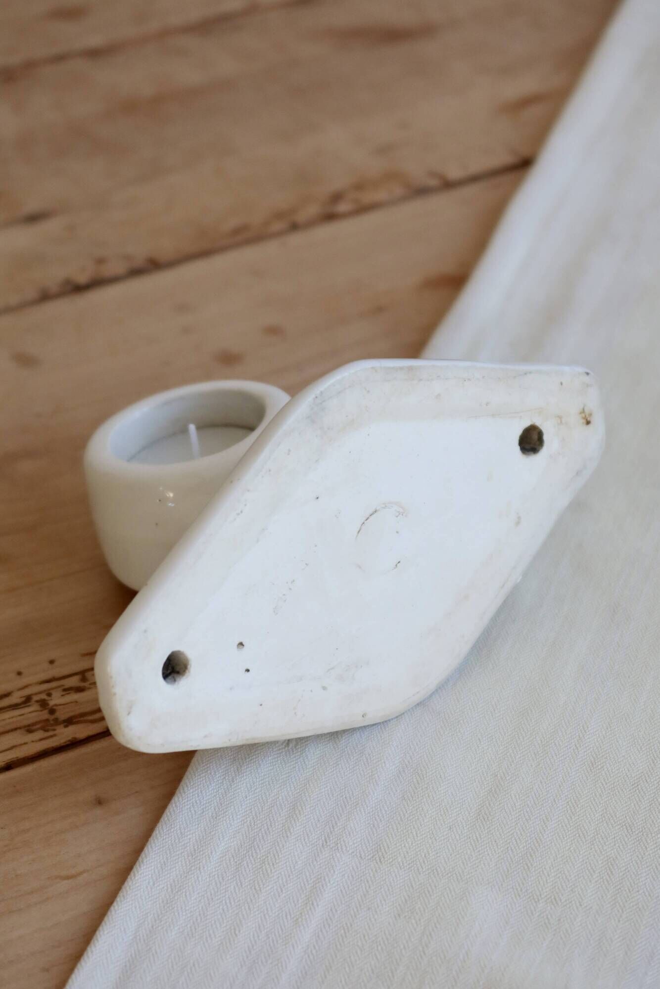 Antique wall candle holder in white porcelain