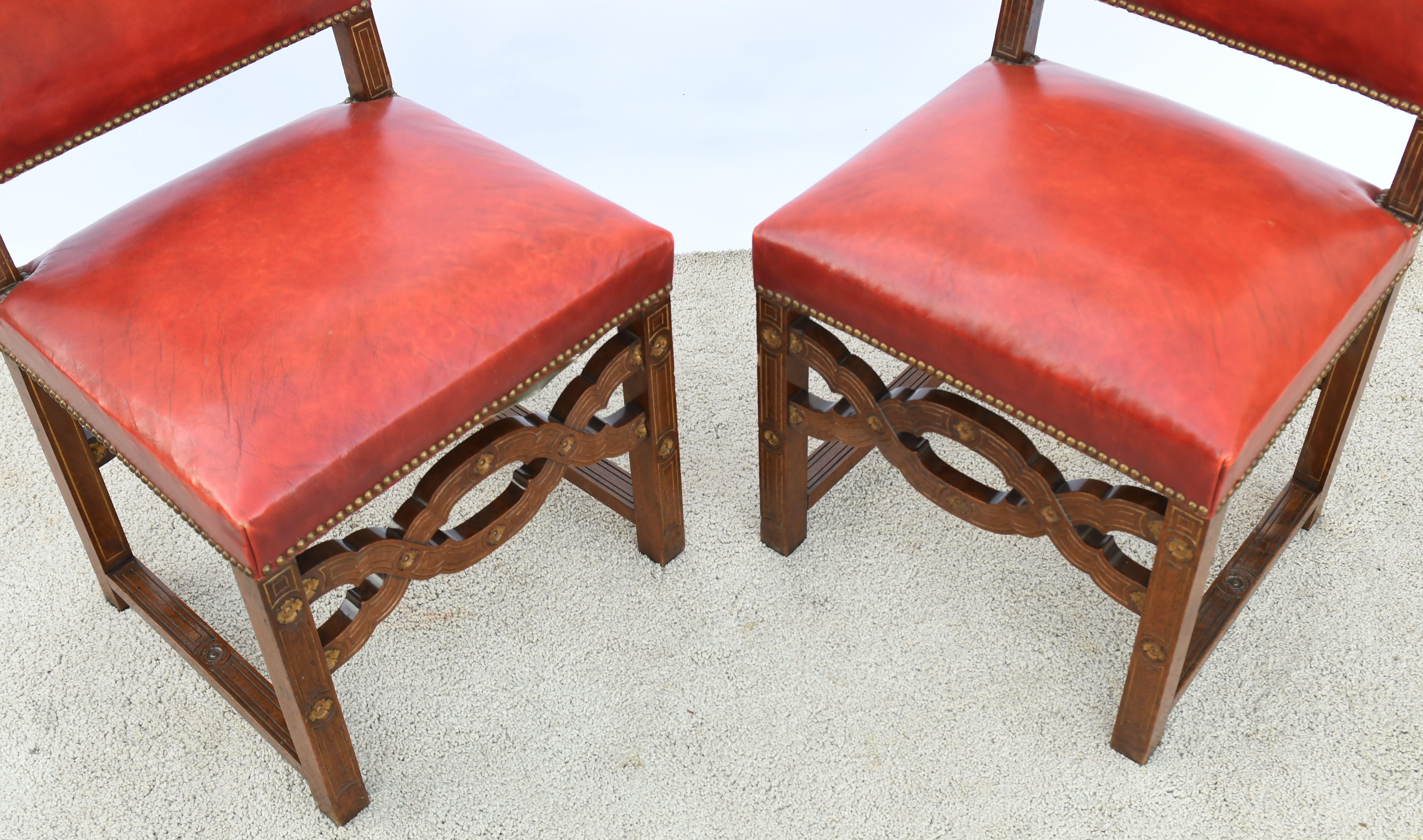 6 red leather chairs