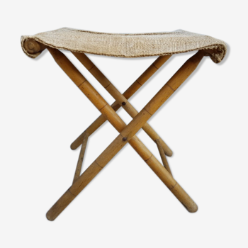 Folding stool sitting in ecru canvas