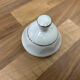 Vintage coffee pot in white porcelain with a gold trim.