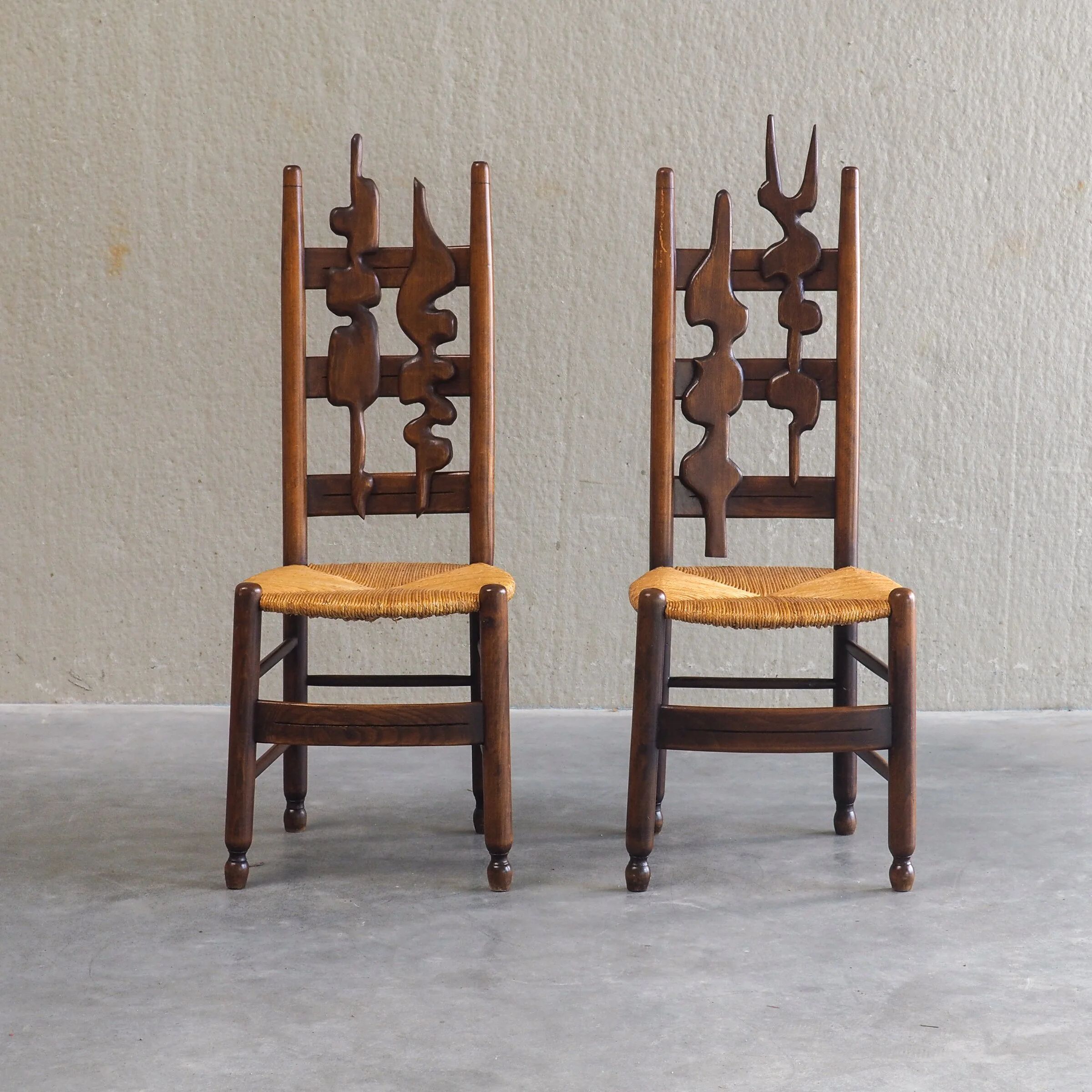 2 sculptural brutalist high-back chairs