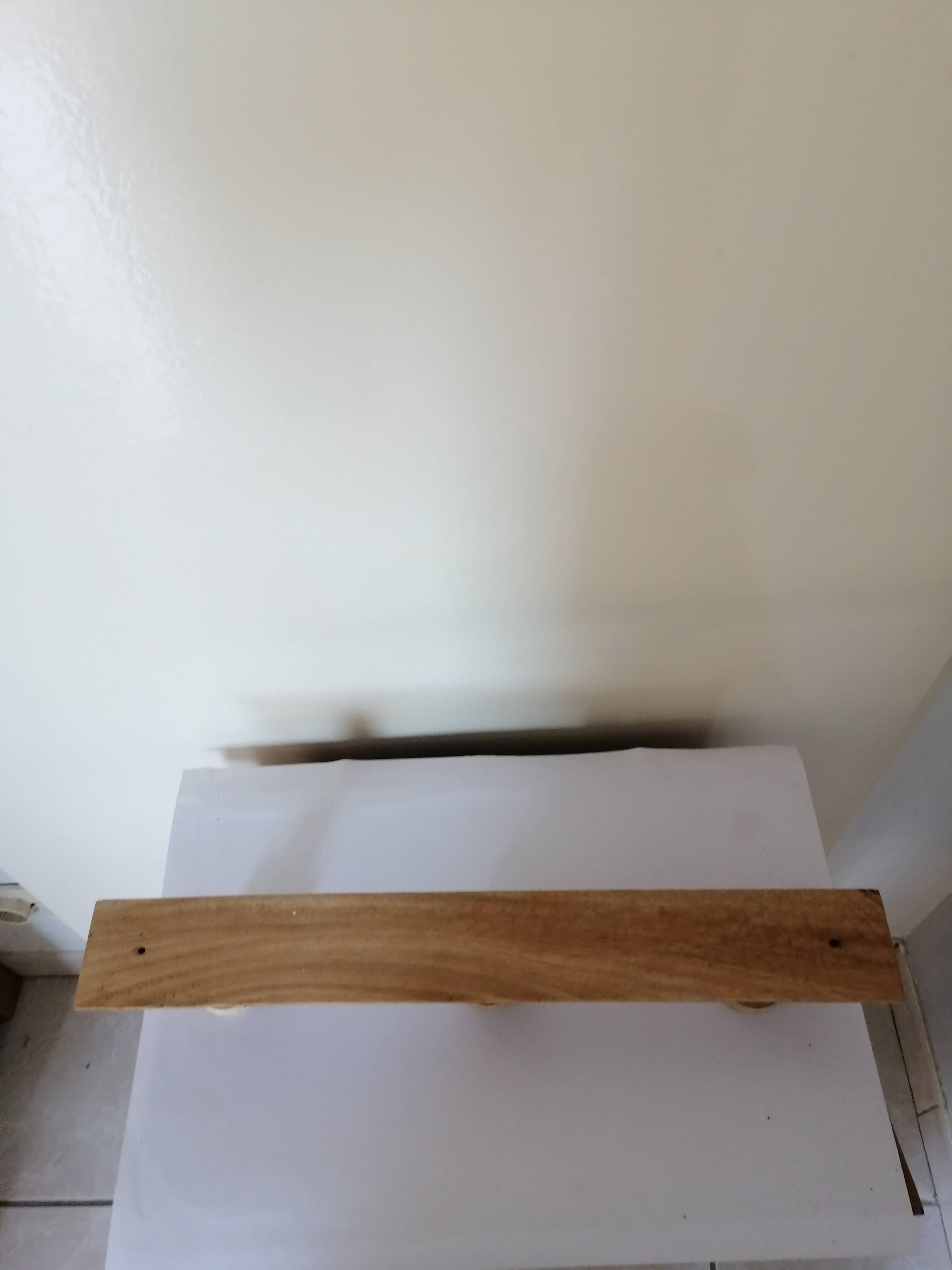 Old wall coat rack in raw wood