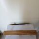 Old wall coat rack in raw wood