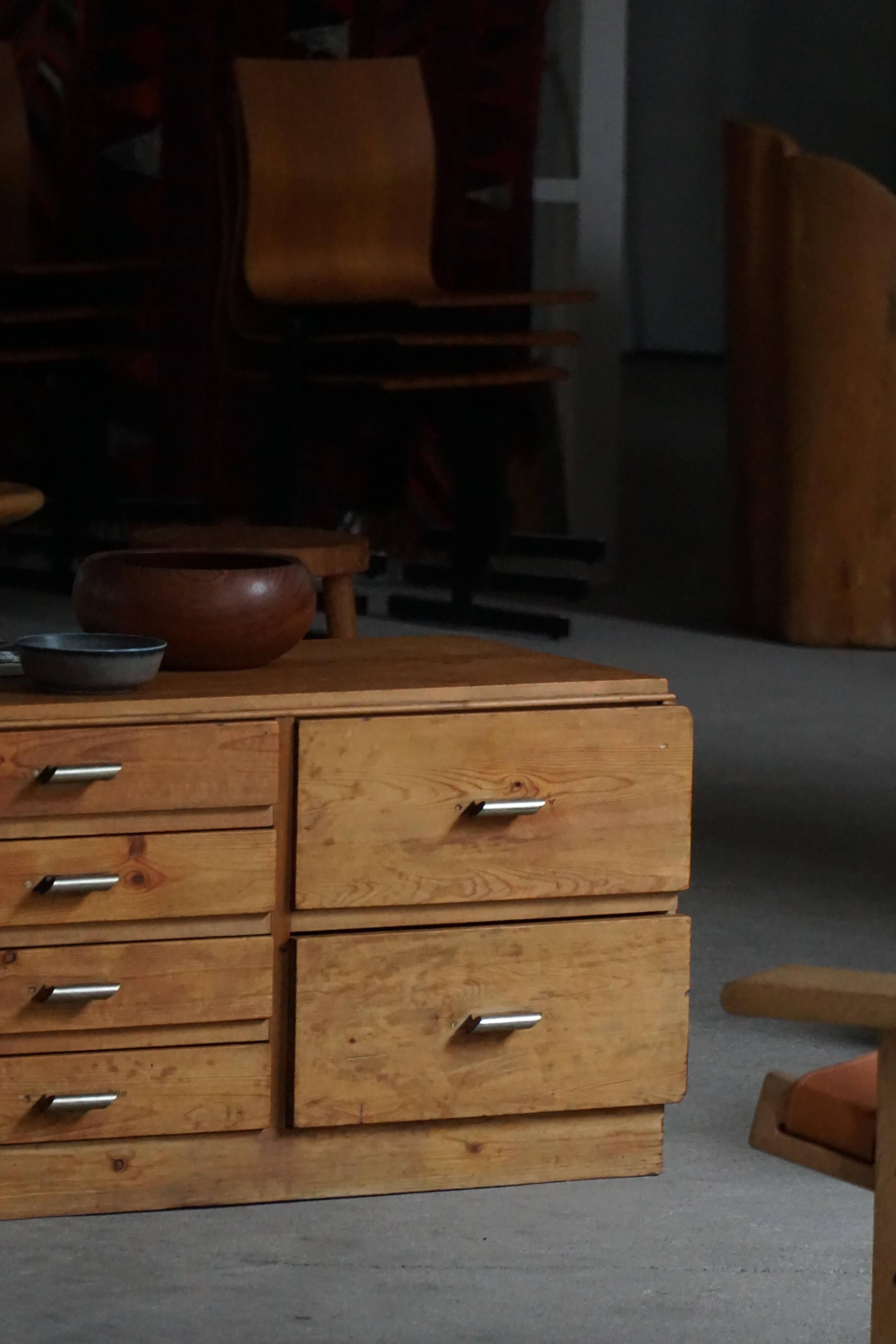 Mid-20th century Art Deco chest of drawers in pine with metal handles, 1940s.