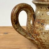 Small beige speckled stoneware pitcher